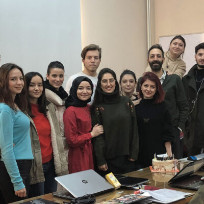 Gokhan Danacioglu with his former students in the class