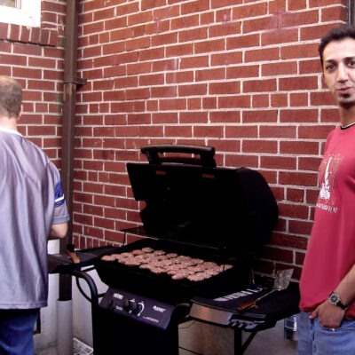 Gokhan Danacioglu (Gokhan Danacioglu in Turkish) at a burger party on the patio with Lyle Auton in Toronto, ON, Canada